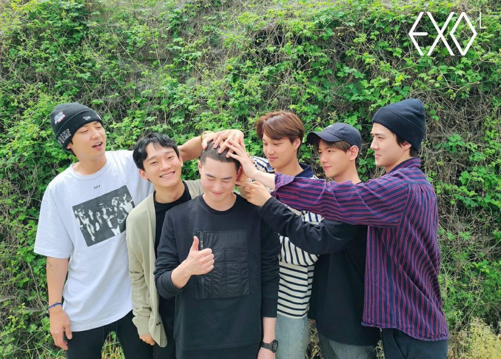 EXO members send off their leader to the military training center