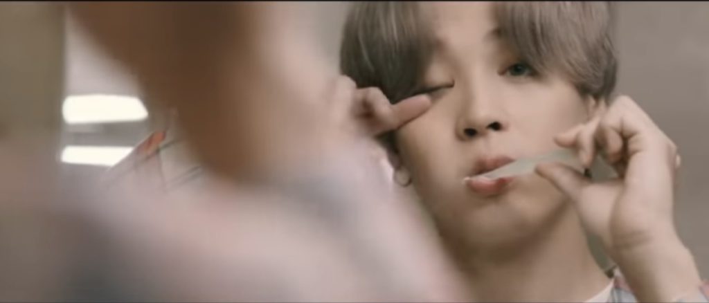 Jimin brushing teeth in "Life Goes On" MV