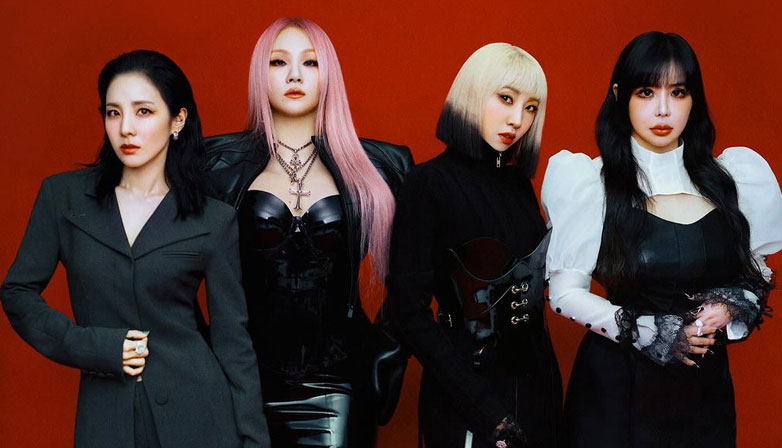 Members of 2NE1 in 15th-anniversary photo.