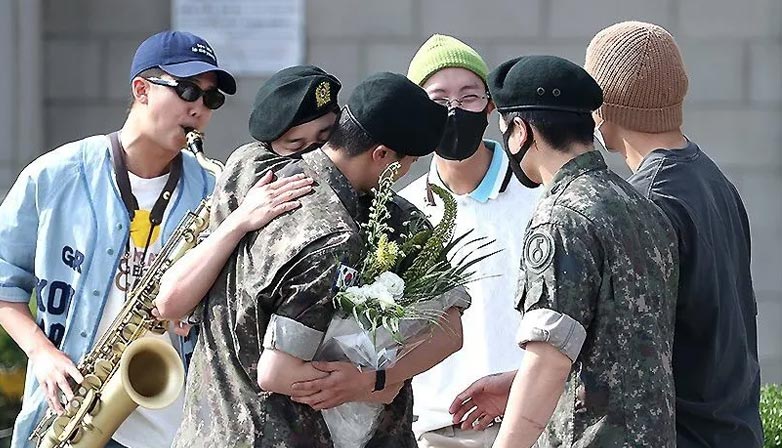 BTS members welcome the return of Jin on military discharge date.