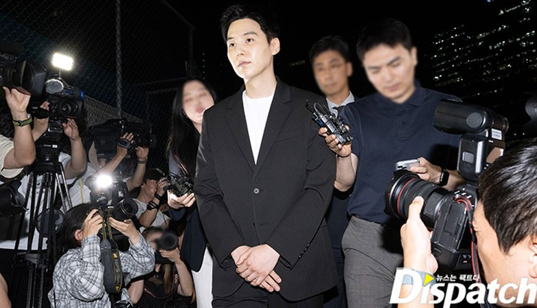 BTS Suga facing reporters at the police station. | Dispatch