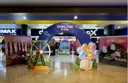 A theater lobby in Latin America decorated for HYBE CINE FEST in LATAM.